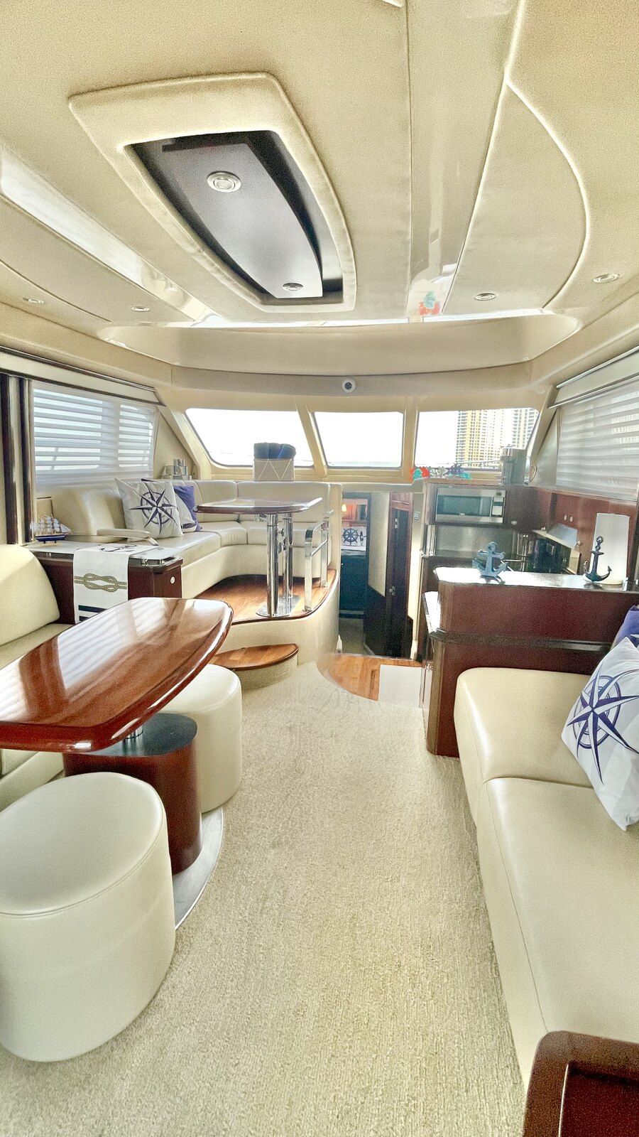 Main salon of Lady Skarlet with leather seating and dining table