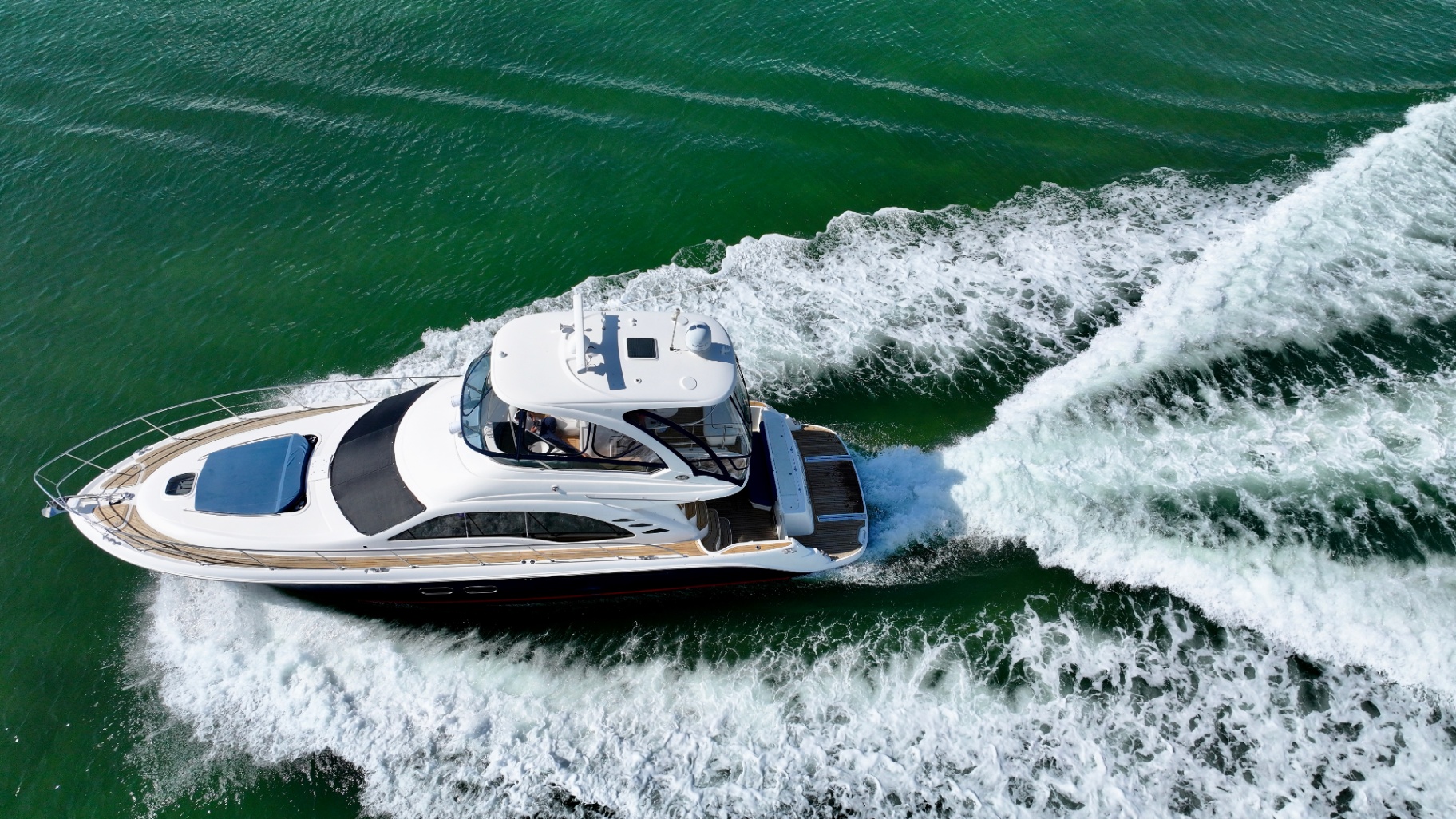 Lady Skarlet cruising over green water